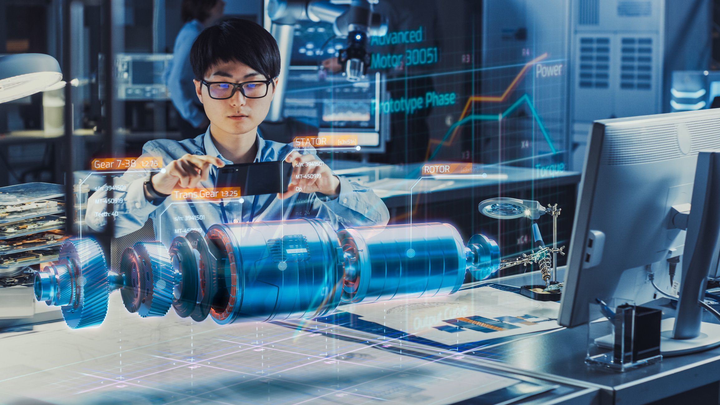 Engineer uses augmented reality to visualize an auto part