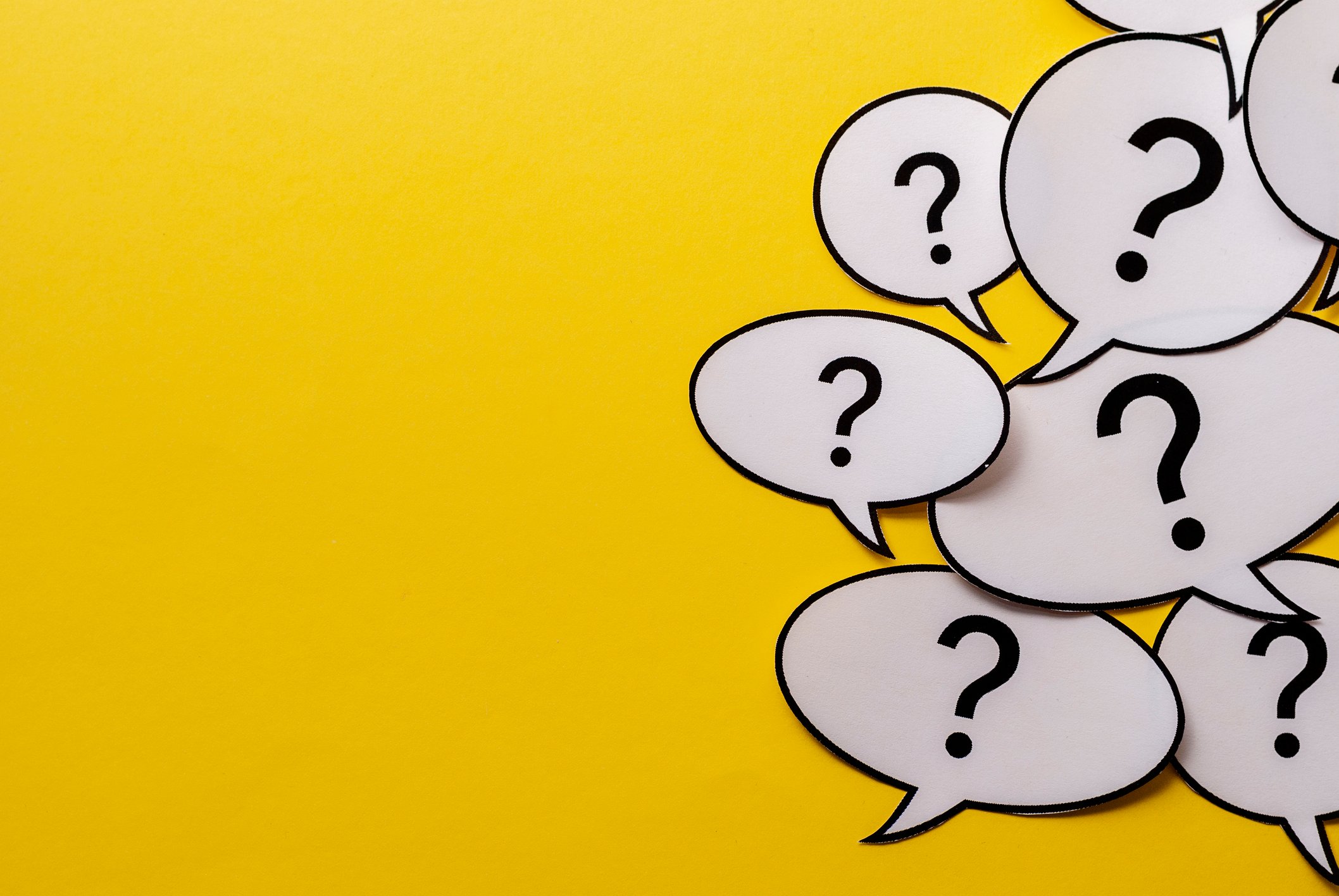 Multiple questions marks in speech bubbles.