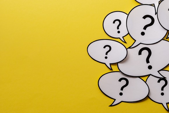 Multiple questions marks in speech bubbles.