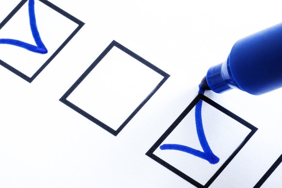 Three checkboxes, with the first containing a blue checkmark, and a blue marker making a checkmark in the third