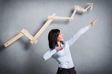 Woman extending arms with wooden line trending up