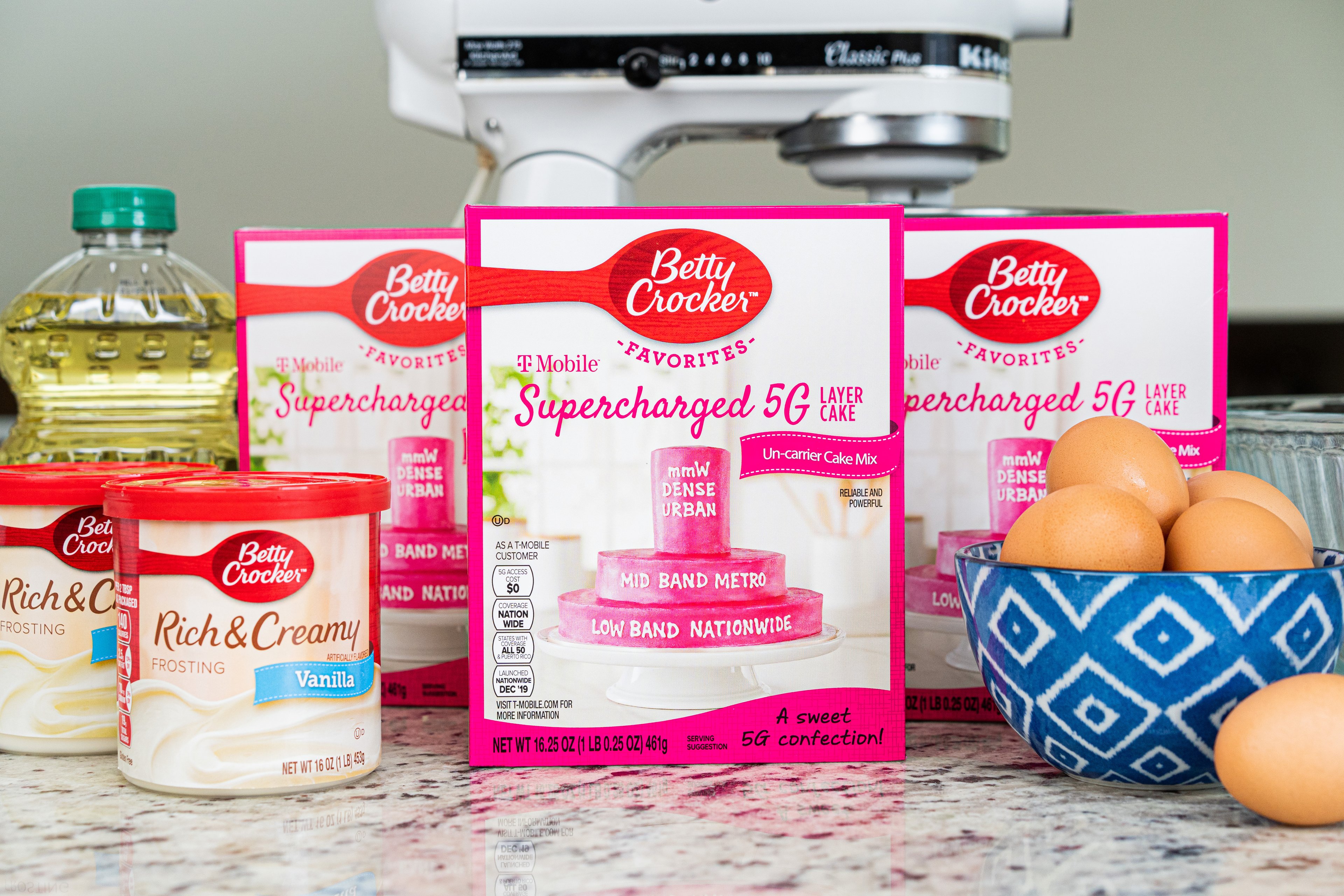 A photo of cake mix boxes, eggs, and related ingredients for the T-Mobile layer cake from Betty Crocker.