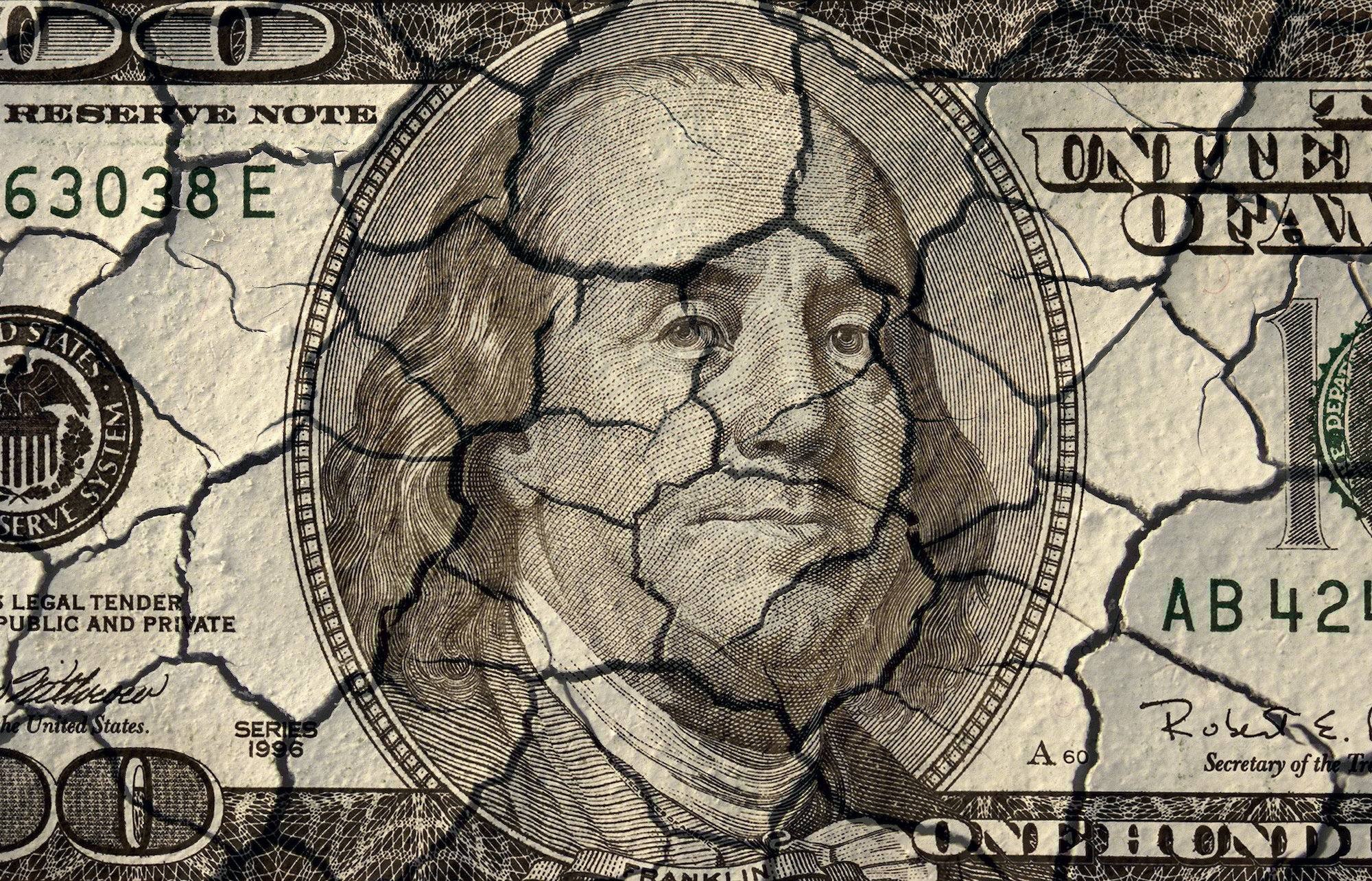 A cracked hundred dollar bill.