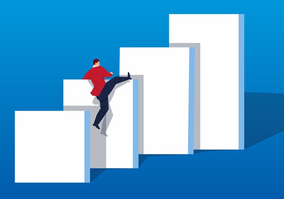 Man climbing increasingly higher walls