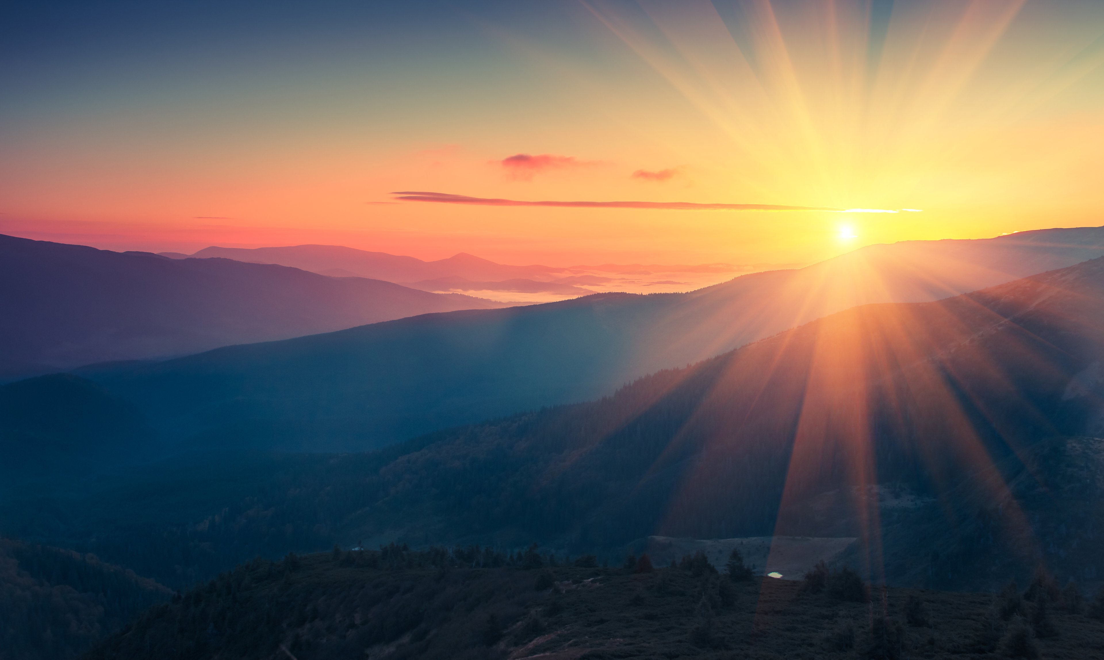 Panoramic view of colorful sunrise in mountains