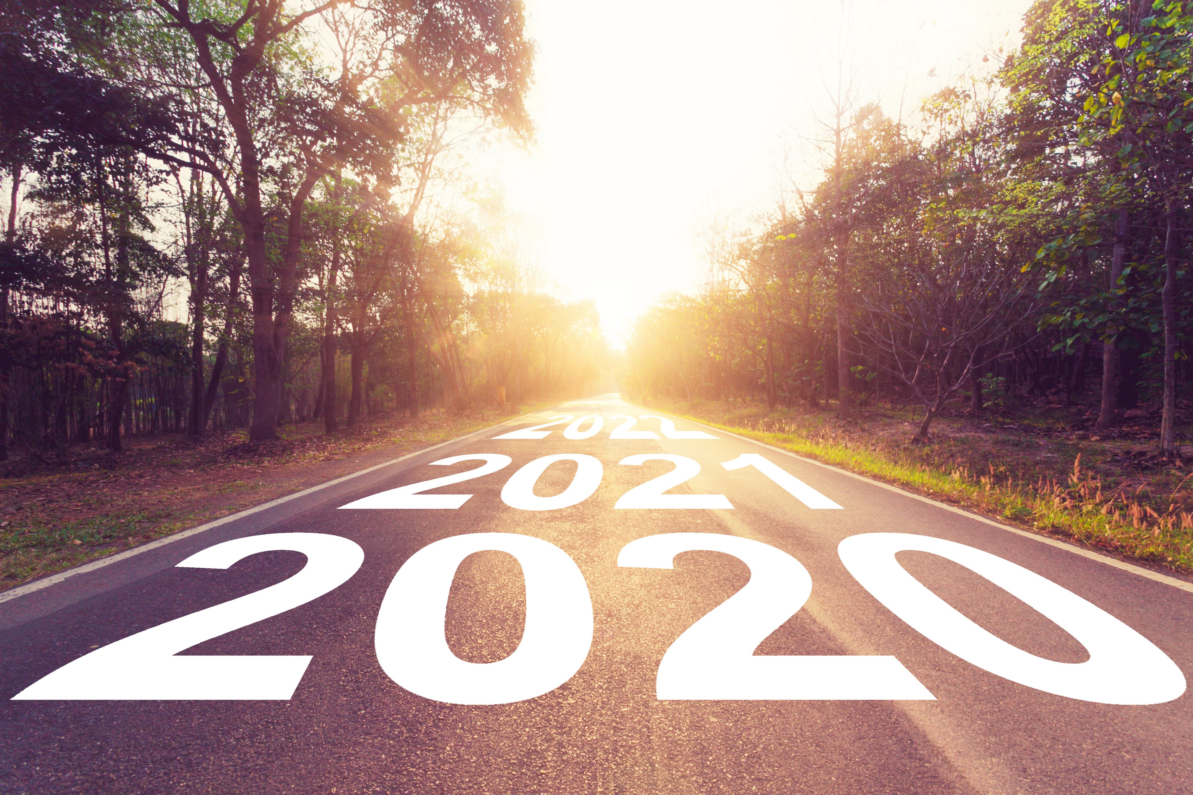 Road with 2020 and 2021 written across it, with future years farther down the road. 
