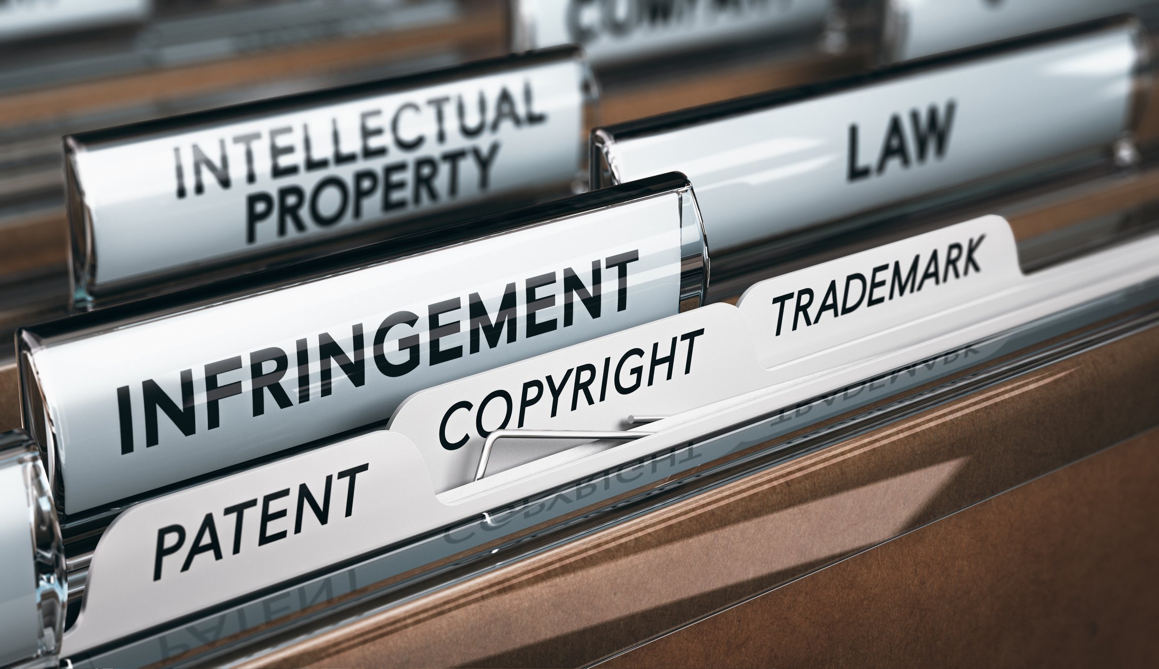 A filing system with labels including "Infringement," "Law," "Intellectual Property," "Patent," and similar words.