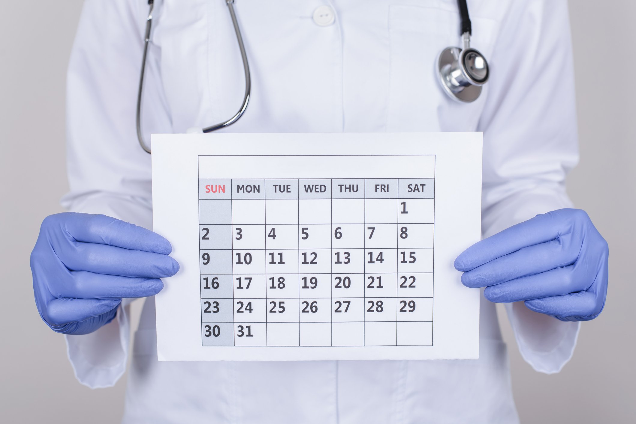 Doctor holding a calendar.