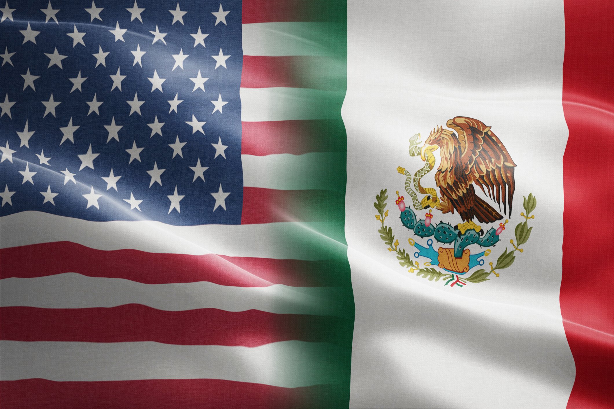 U.S. and Mexico flags together.