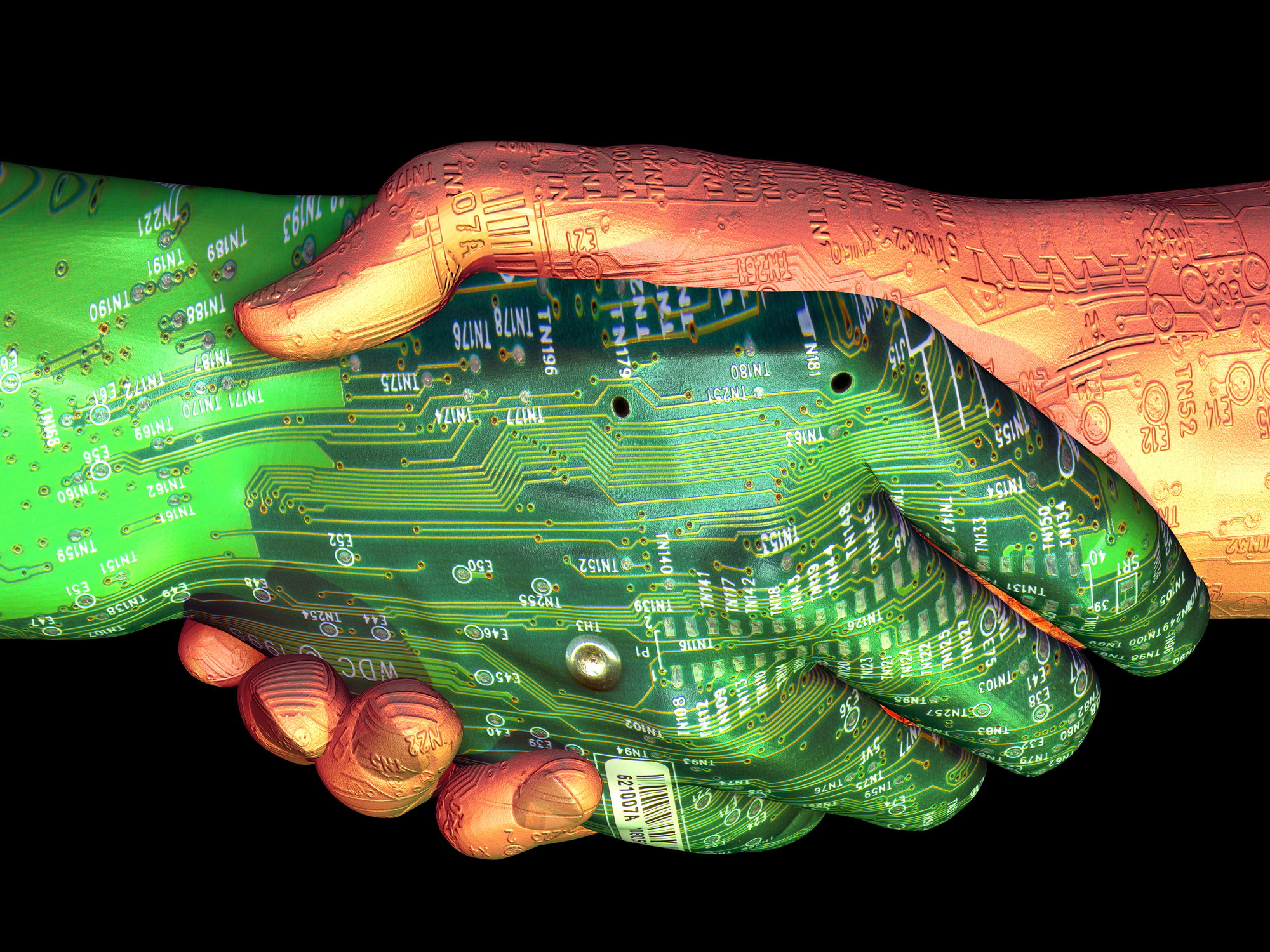 A handshake where one hand is green and covered in circuit board traces.