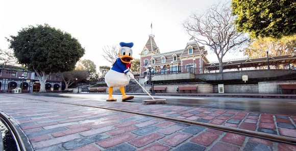 Donald Duck sweeping Main Street U.S.A. at Disneyland in California.