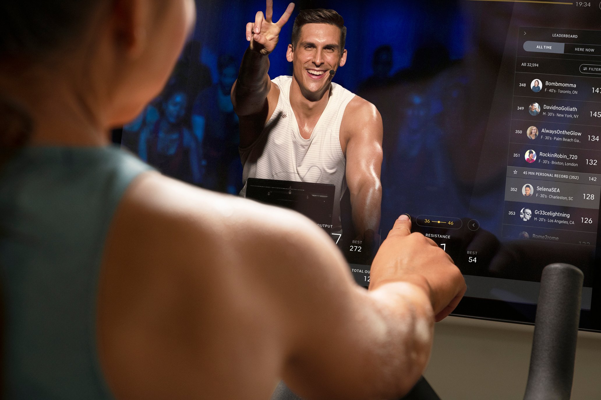 A Peloton user taking a fitness class.