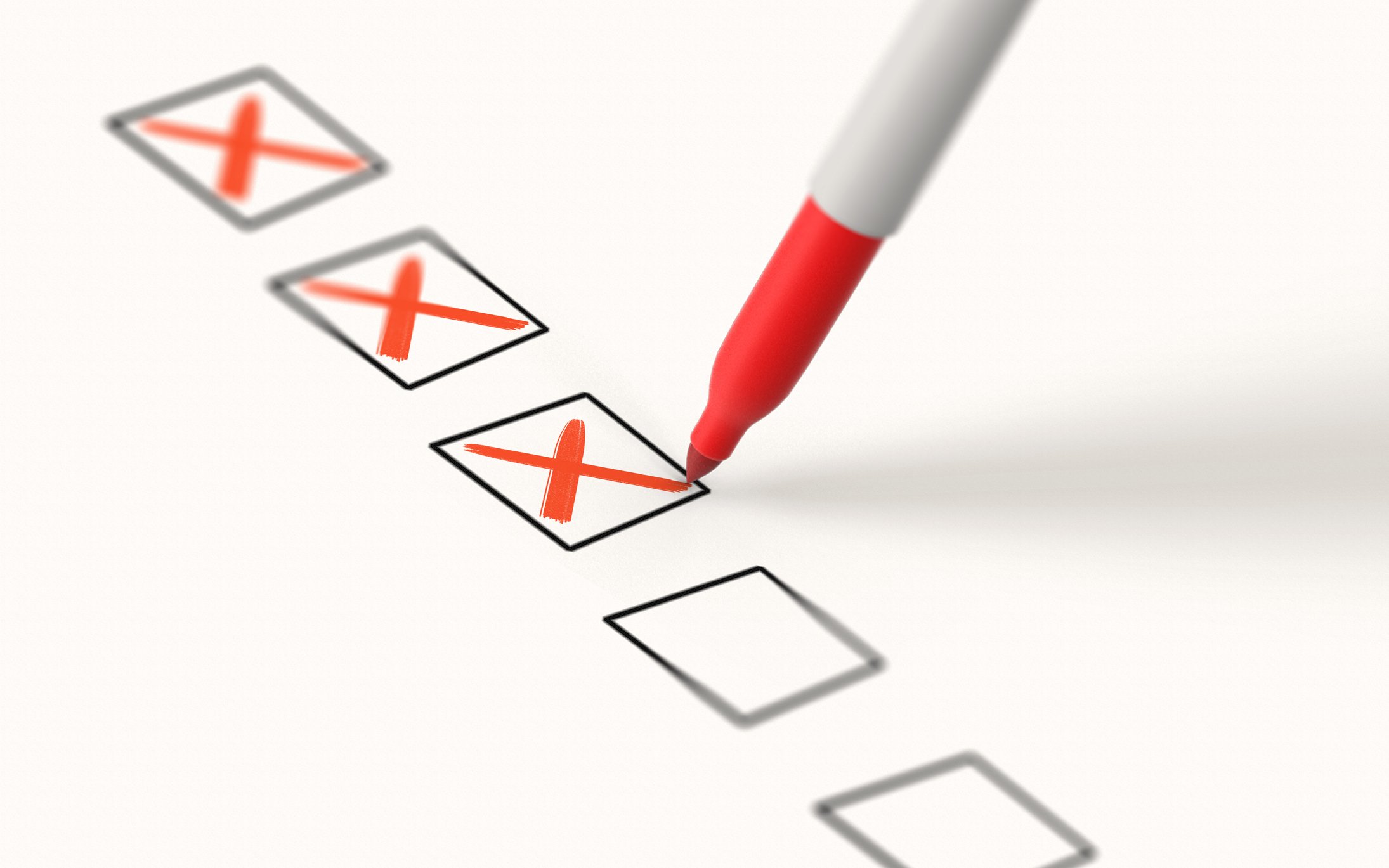 Red marker checking off boxes