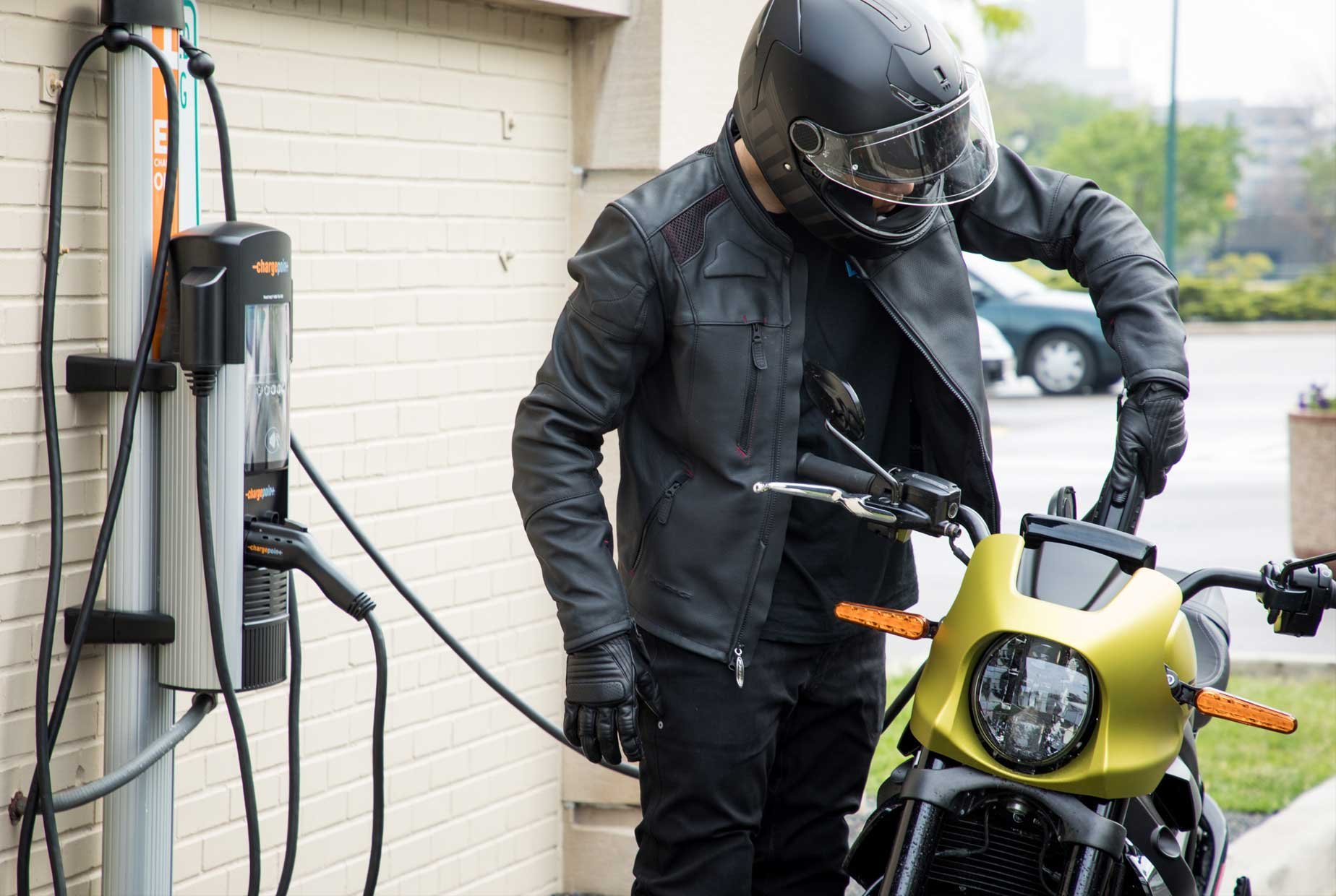 Rider charging the LiveWire motorcycle