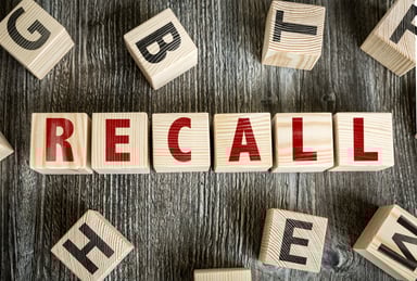 recall spelled out with wooden blocks