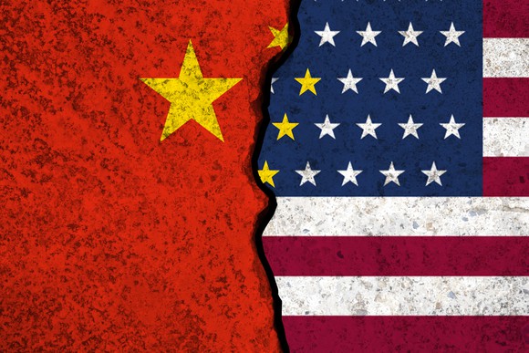 Half of China flag, and half of U.S. flag, with a huge crack in between them