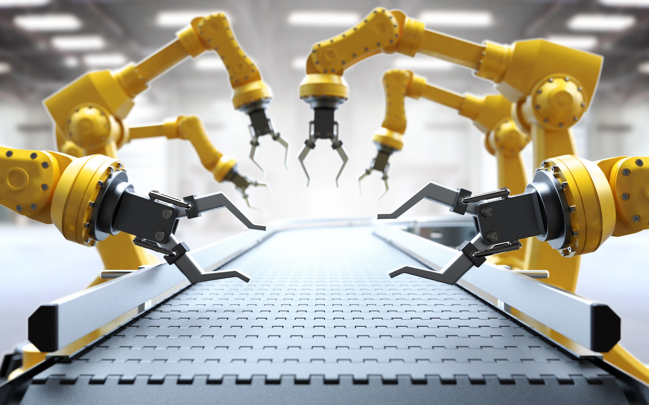 Robotic arms in an assembly line.