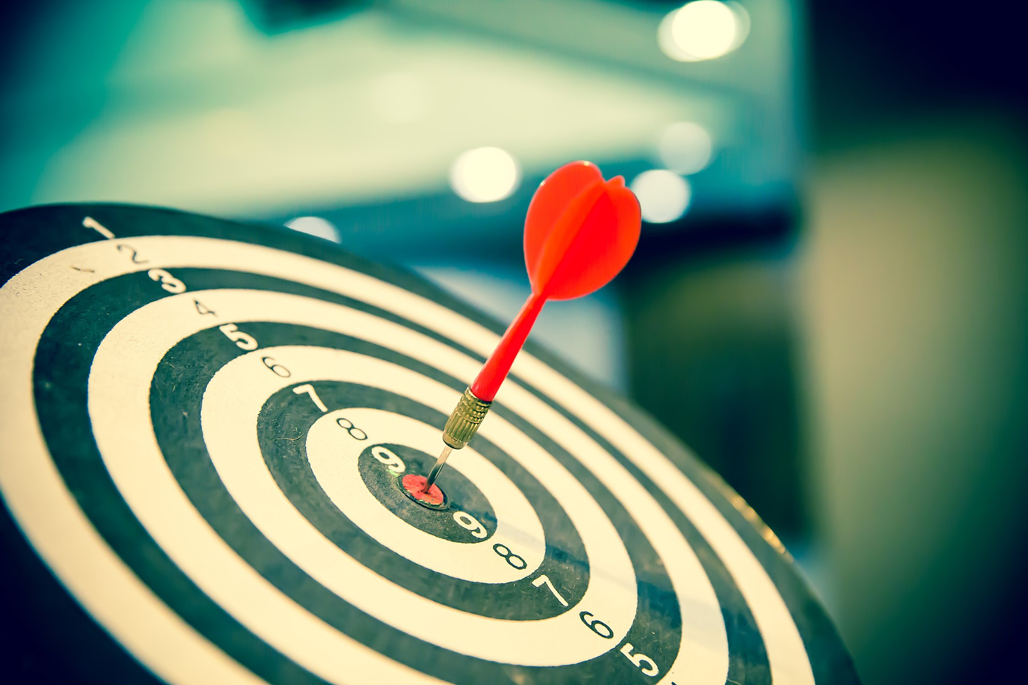 A dart hitting a bullseye.