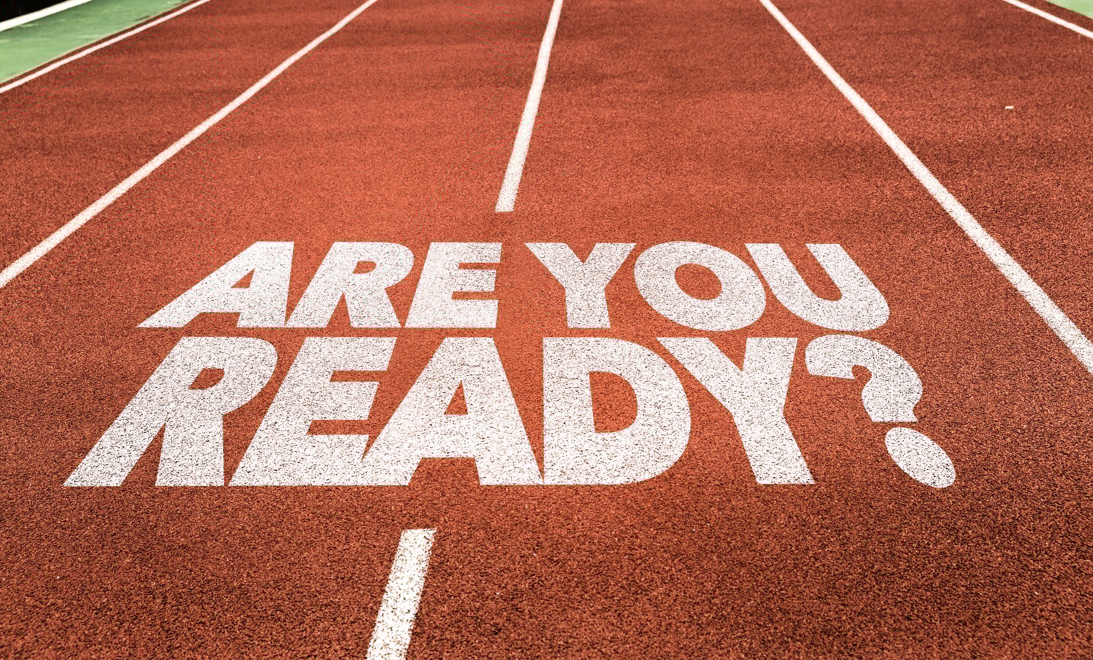 The question are you ready is printed on a running track.