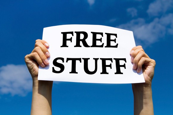 Man holding a "free stuff" sign.