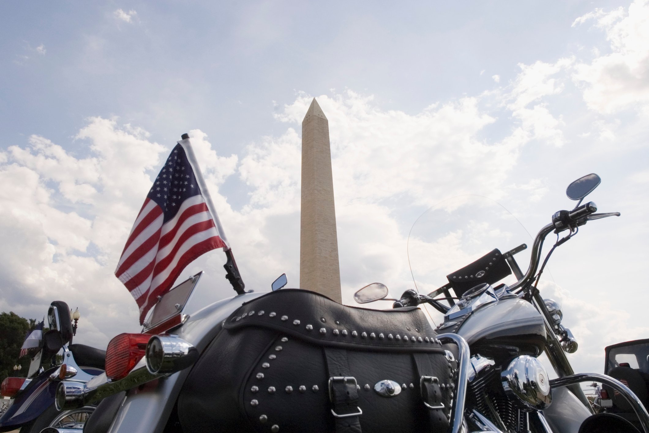 Motorcycle with American flag in front of Washington Monument
