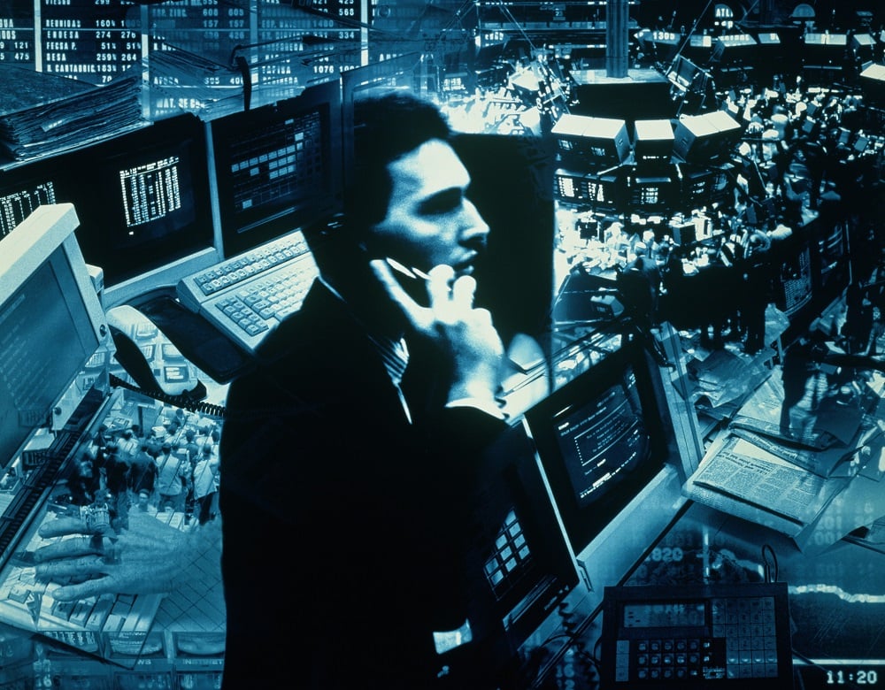 Trader on stock exchange floor.