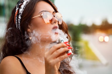 girl smoking an e-cigarette
