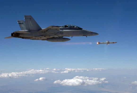 A warplane firing a Northrop Grumman guided missile.