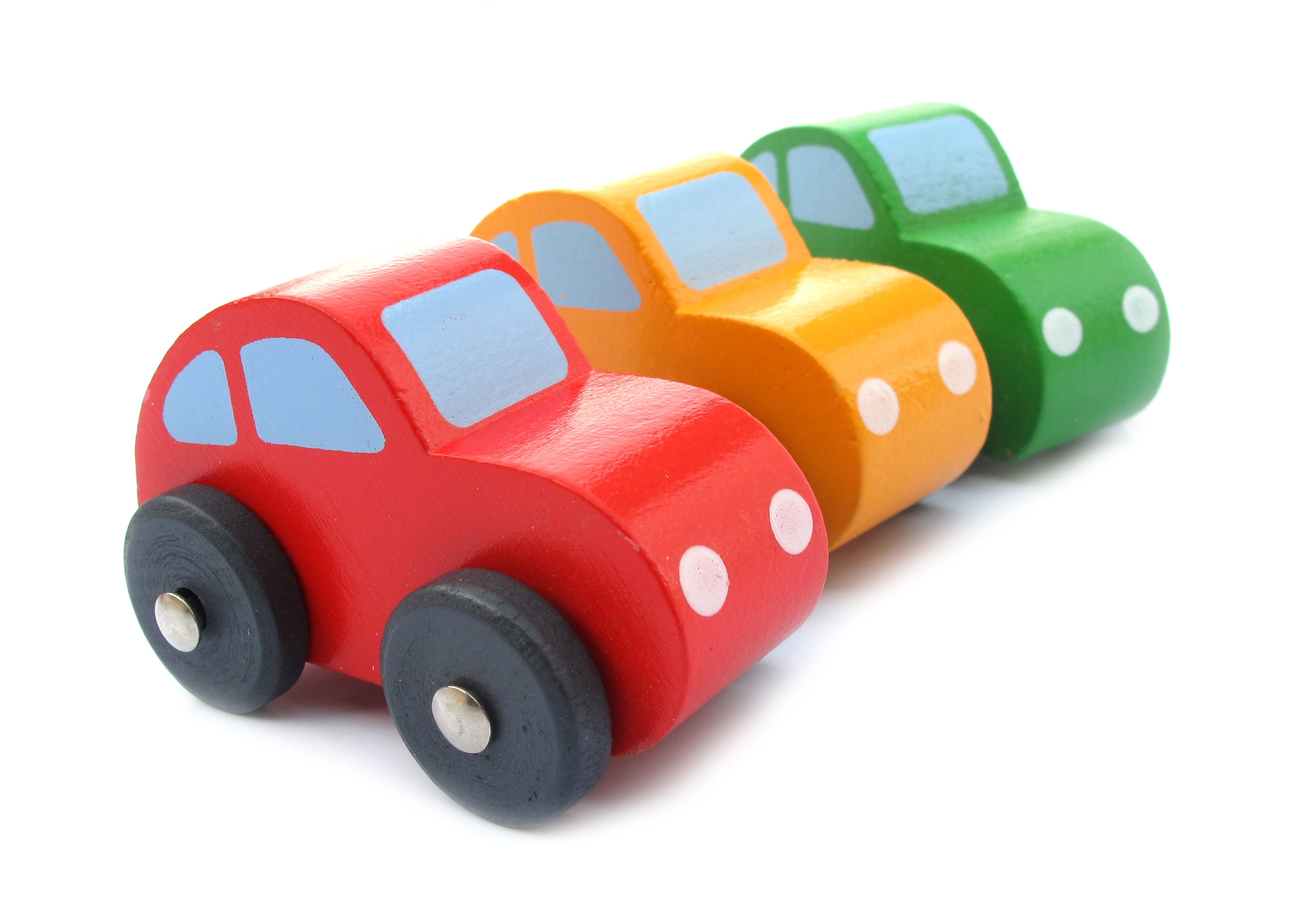 Three brightly colored toy cars in a row