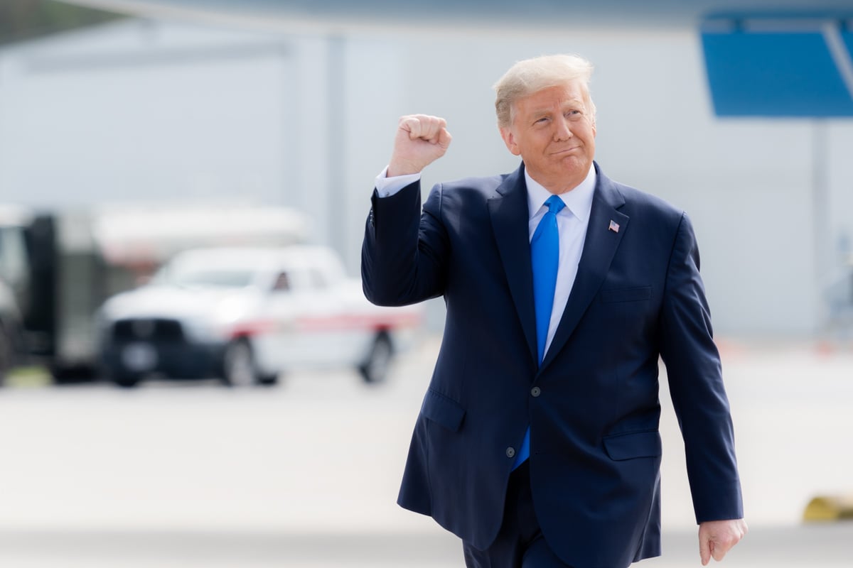 President Trump raising his fist at a campaign rally in North Carolina.