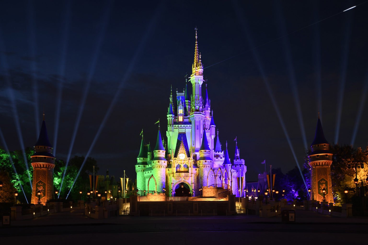 Disney castle lit up at night