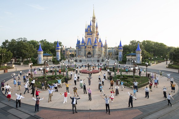 Walt Disney World reopening with cast members in front of the Disney castle