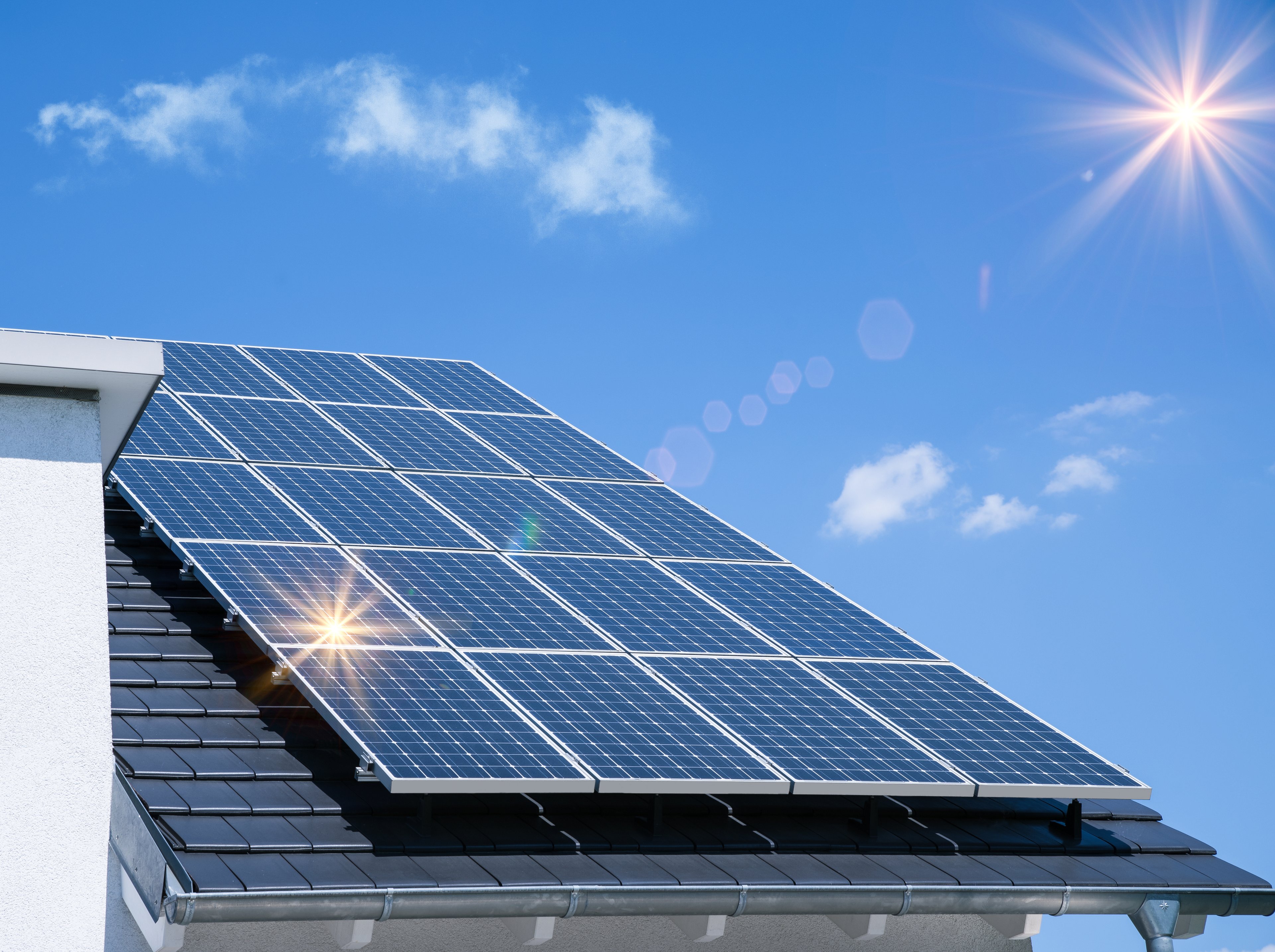 Roof with large solar installation on a sunny day. 