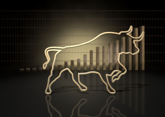 The outline of a bull superimposed on top of an ascending bar graph. 