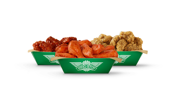 Three plates of Wingstop saucy chicken.