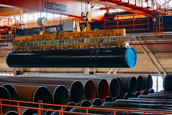 steel pipe used for energy being stacked in warehouse