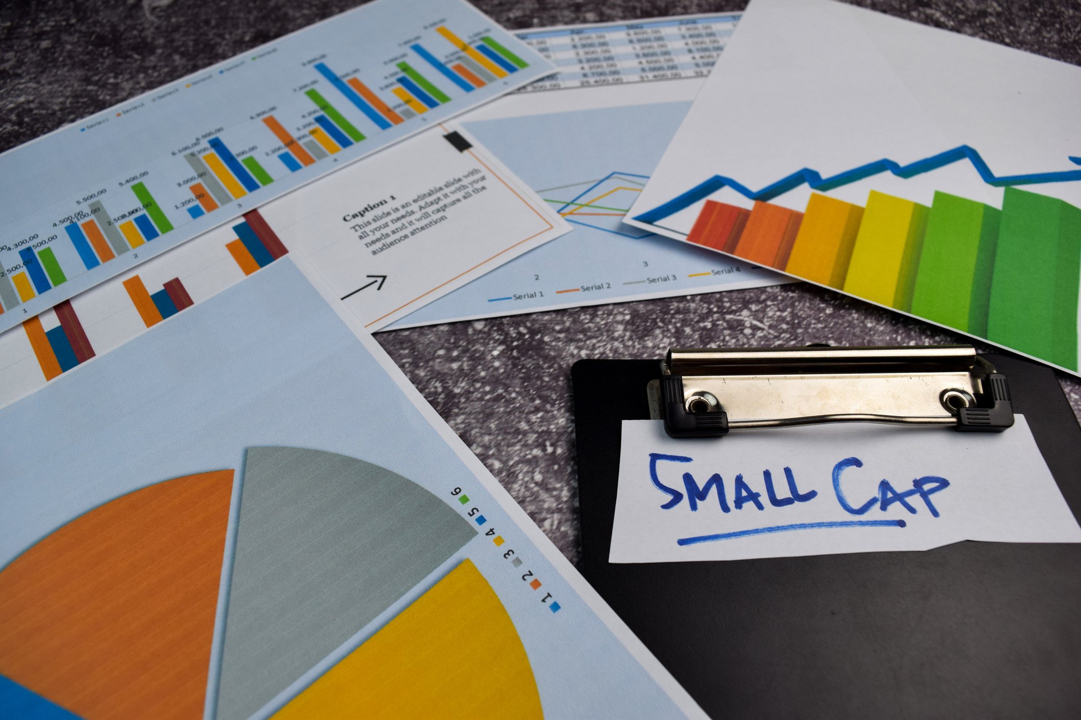 Charts and graphs with an index card reading "Small Cap"