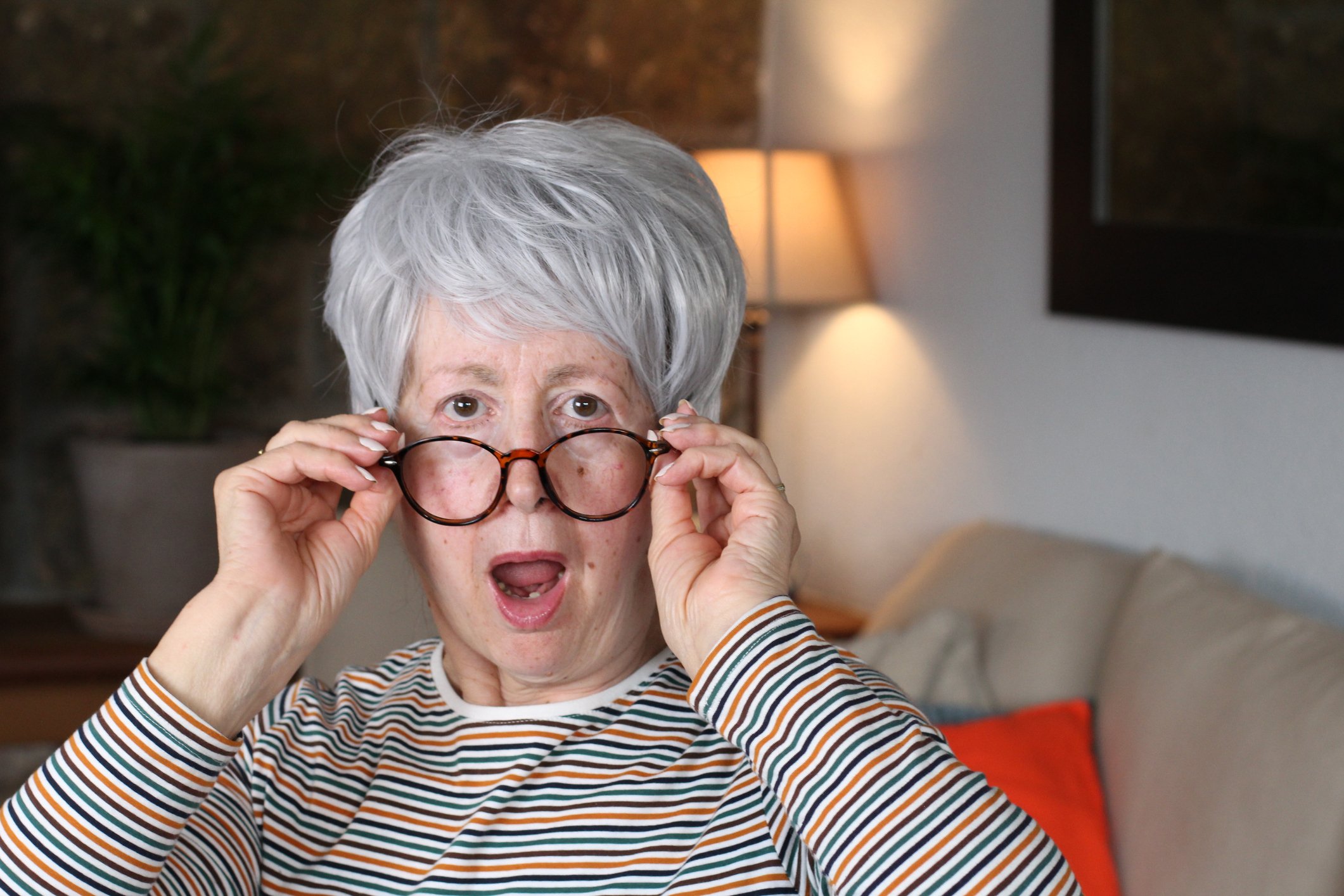 An older person wears a surprised expression. 