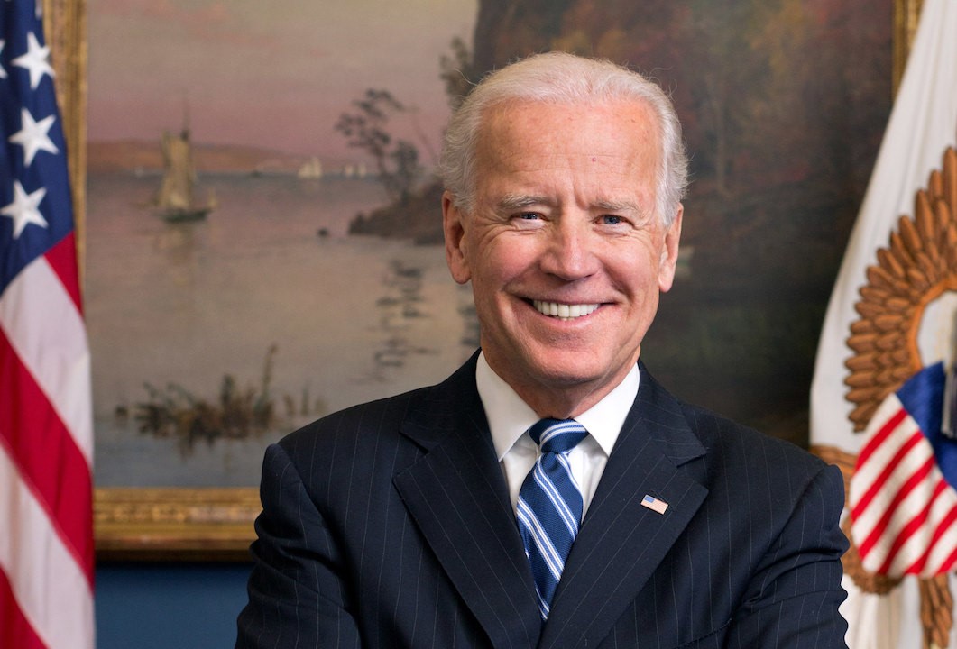 Joe Biden posing for a portrait in the White House.