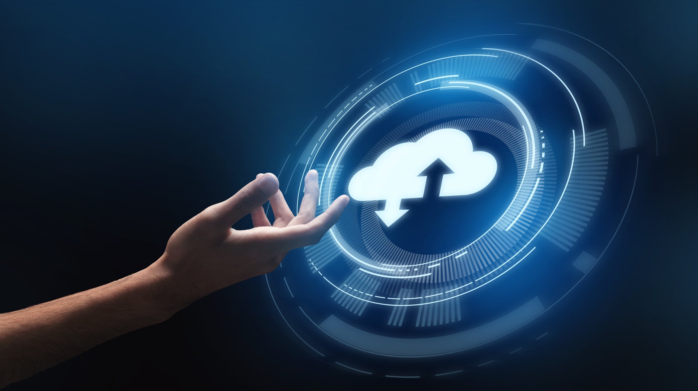 A hand touching an upload-download cloud icon.