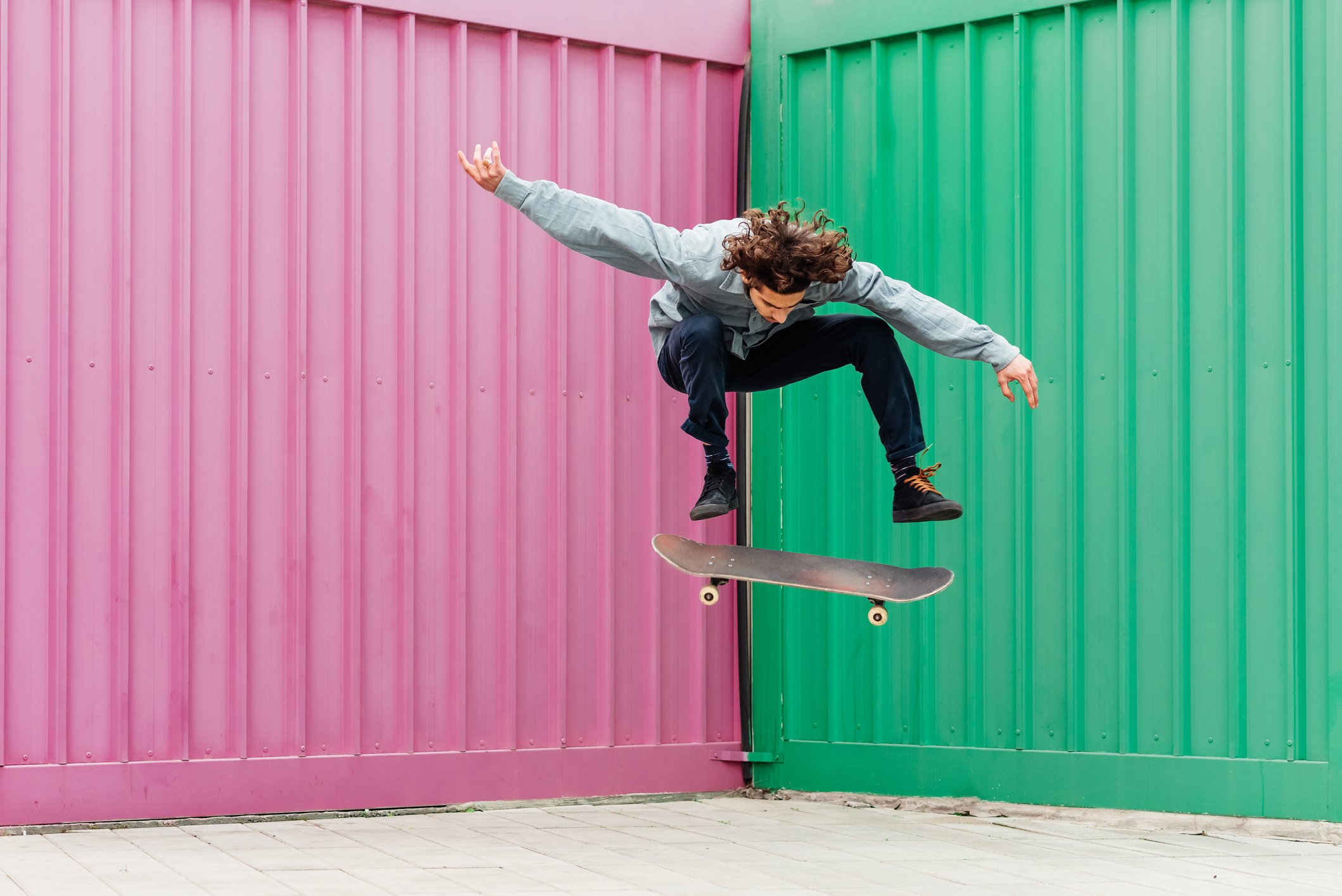 Young man performing moves on a skateboard.