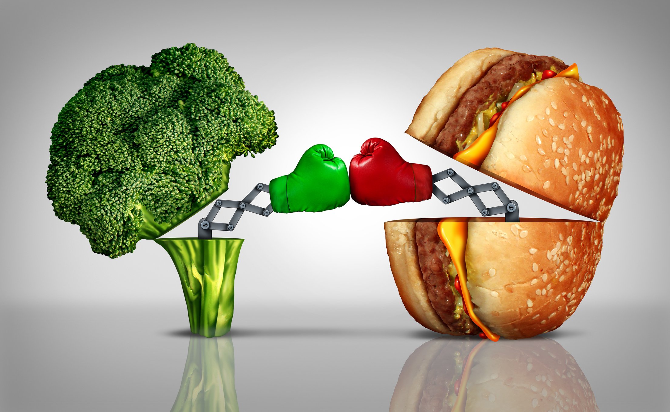 A burger fighting a broccoli with boxing gloves on.