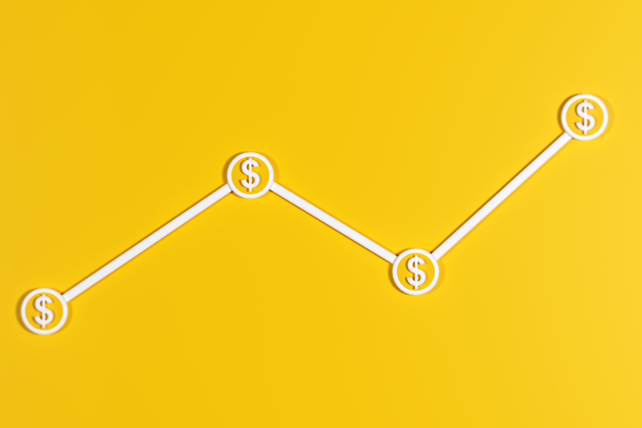A line graph with dollar signs on it.