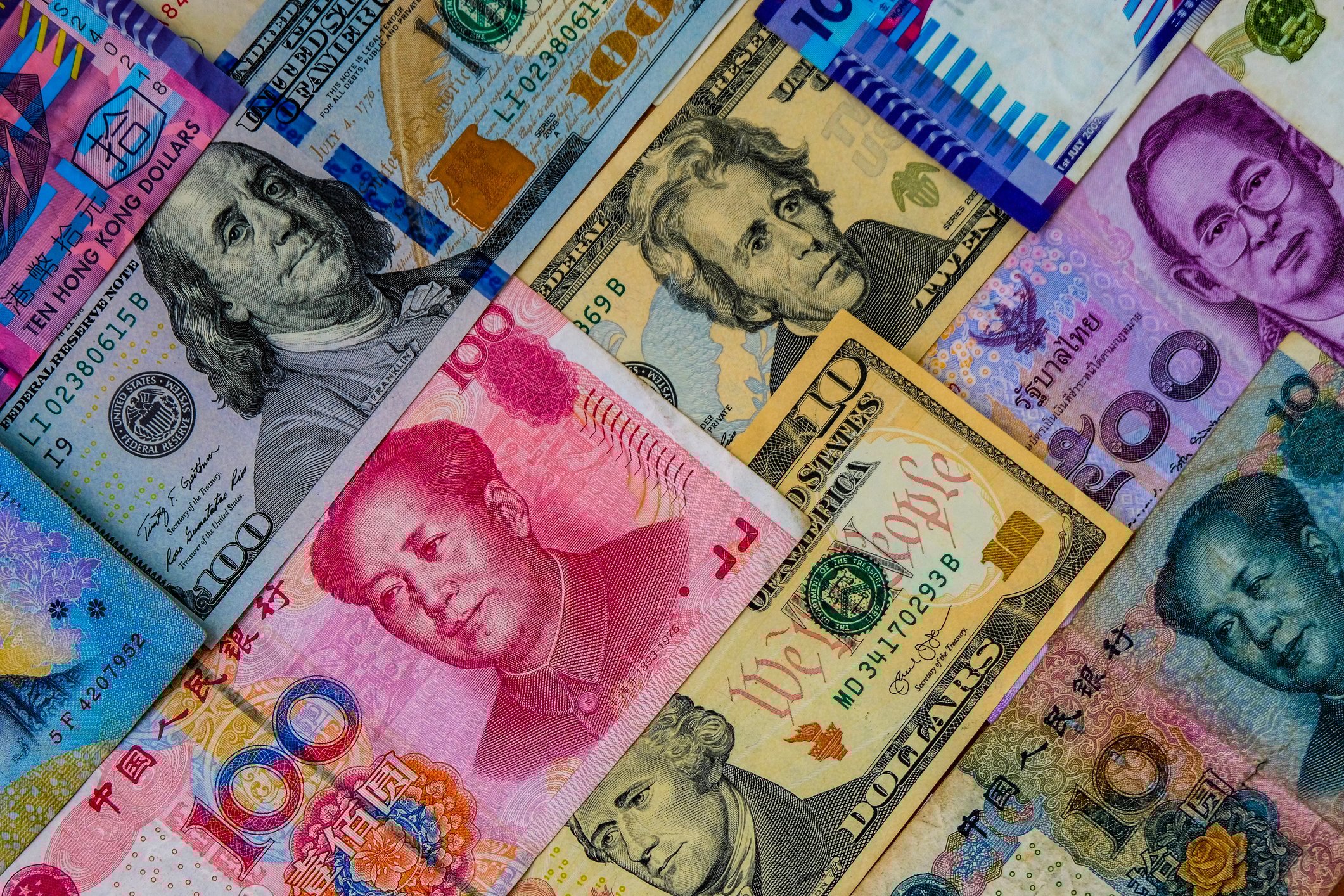 A collection of international bills of varying value.