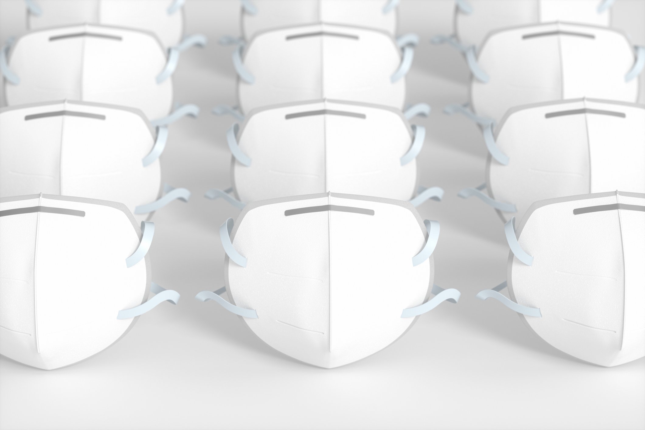 Three rows of white N95 face masks.