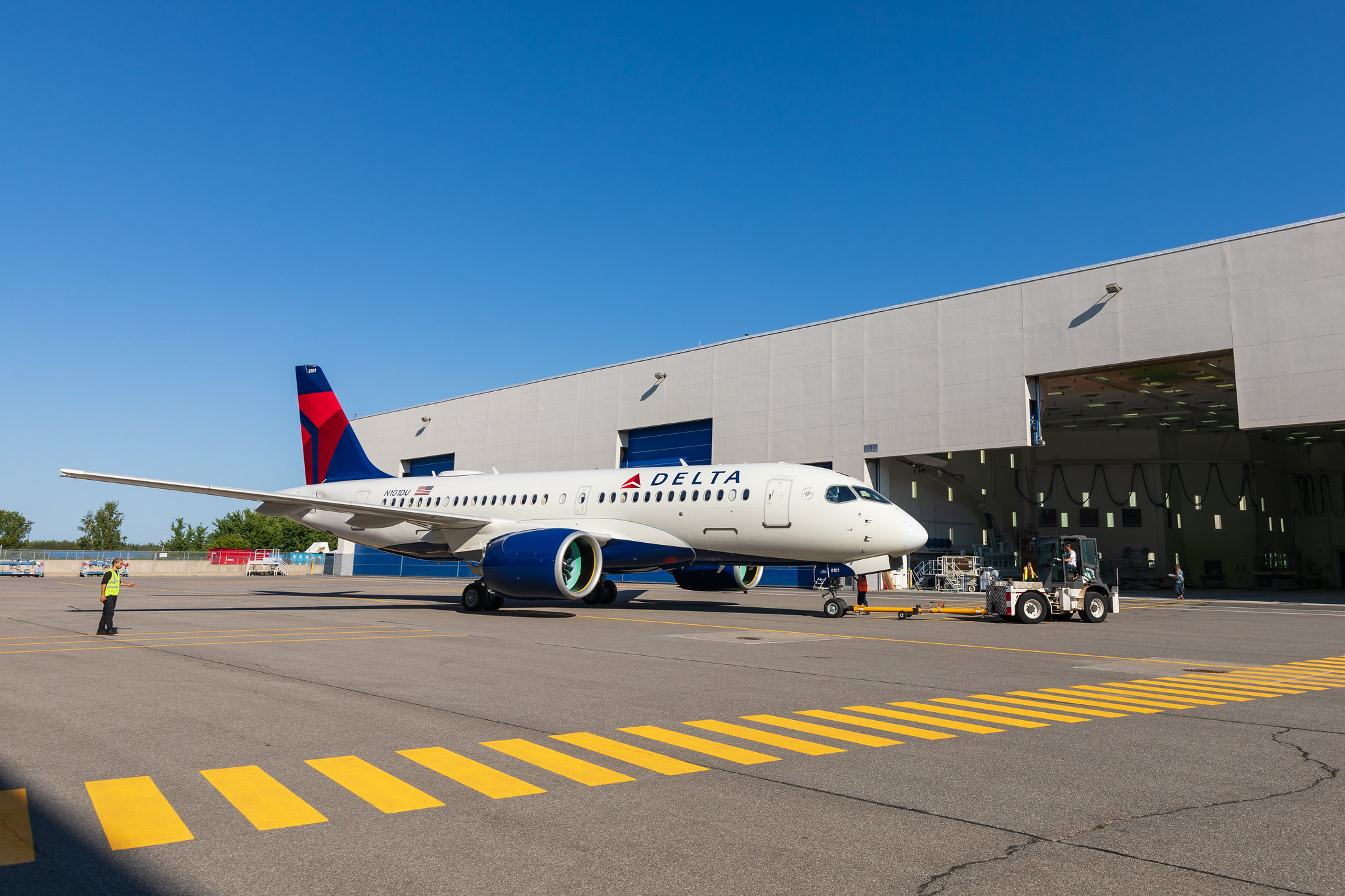 Delta's first Airbus A220 rolls out of a paint shop. 