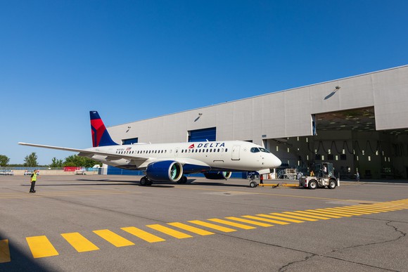 Delta's first Airbus A220 rolls out of a paint shop. 