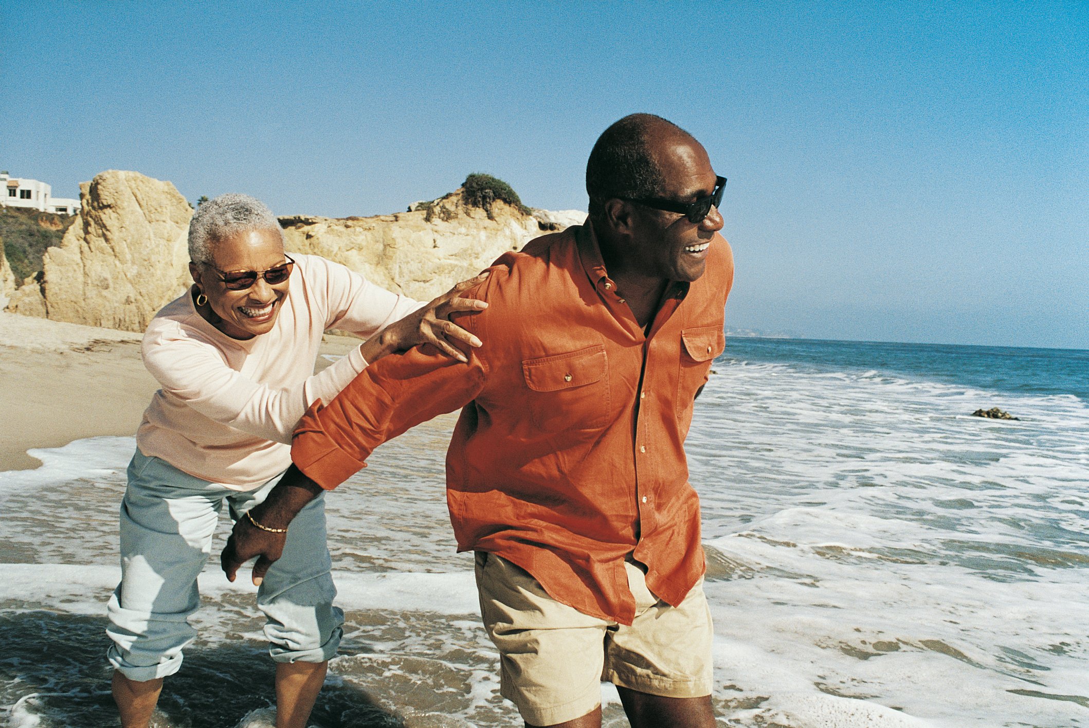 Senior couple having fun  on the beach.