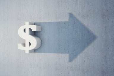 Dollar sign with shadow of an arrow