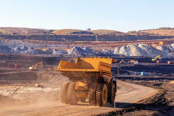 A dump truck on a dirt road at a mining site